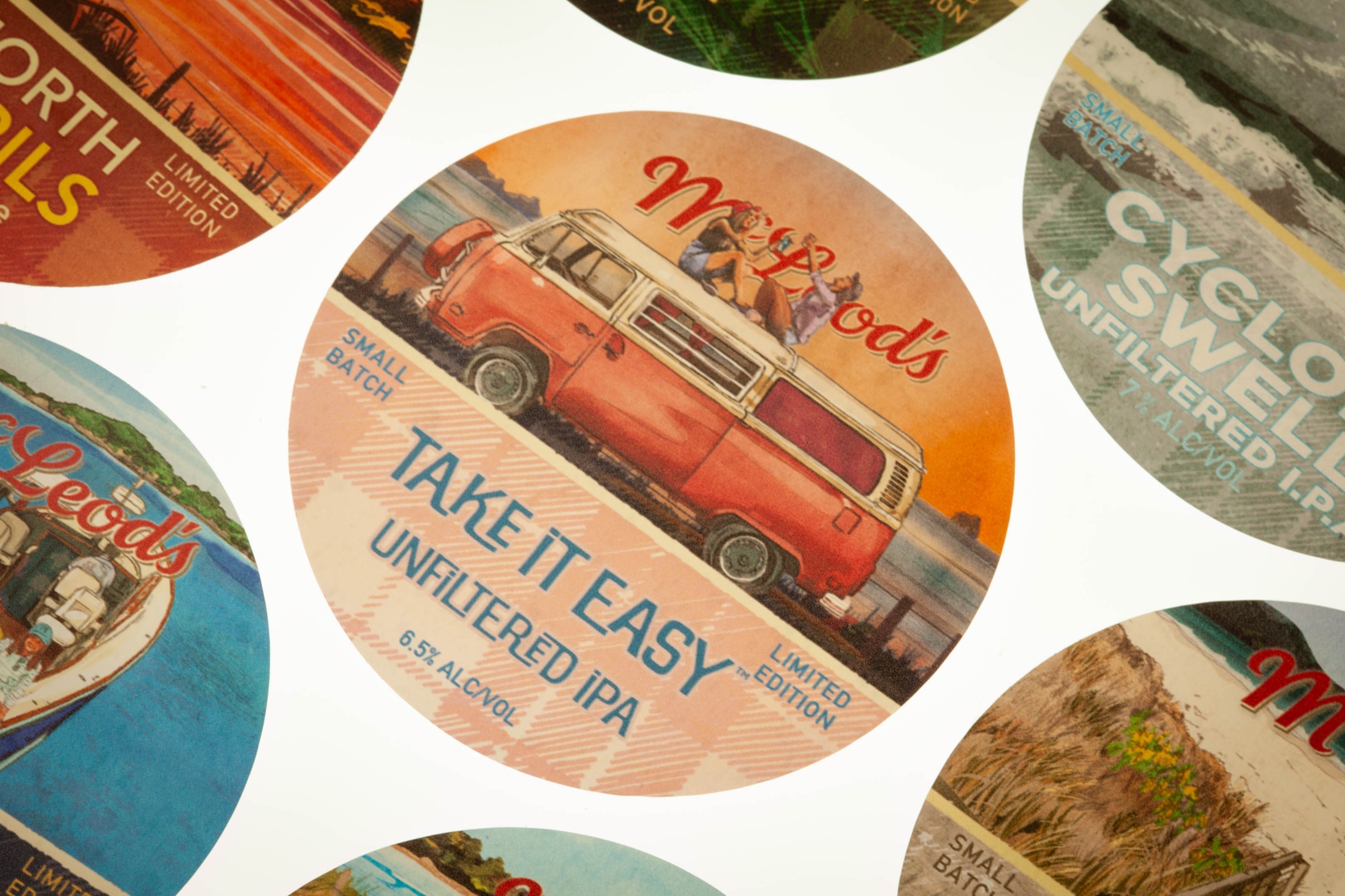 Custom 73mm backlit tap badges printed for McLeod’s Brewery, colour-accurate and kiss-cut for craft beer taps