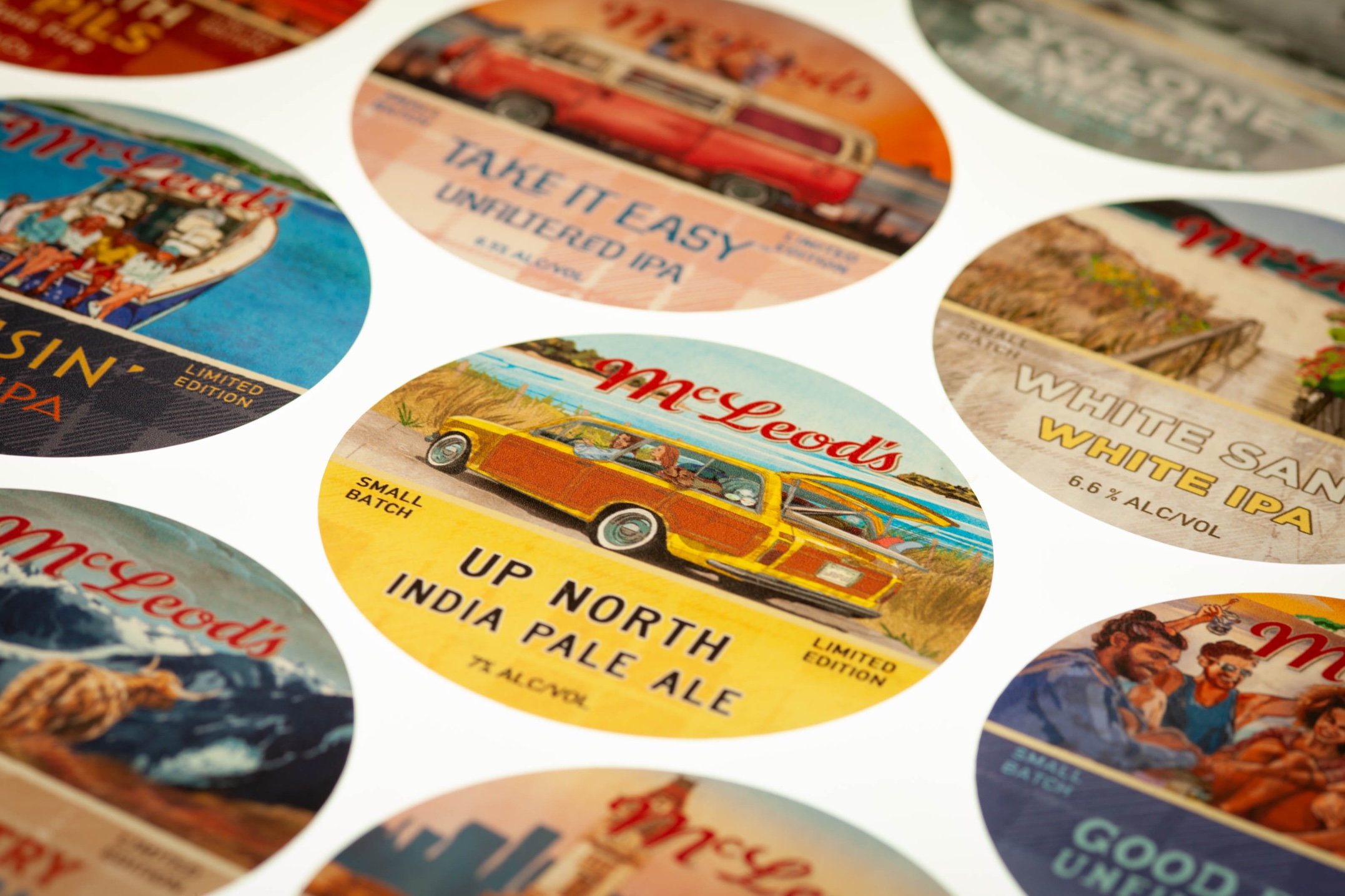 Custom 73mm backlit tap badges printed for McLeod’s Brewery, colour-accurate and kiss-cut for craft beer taps