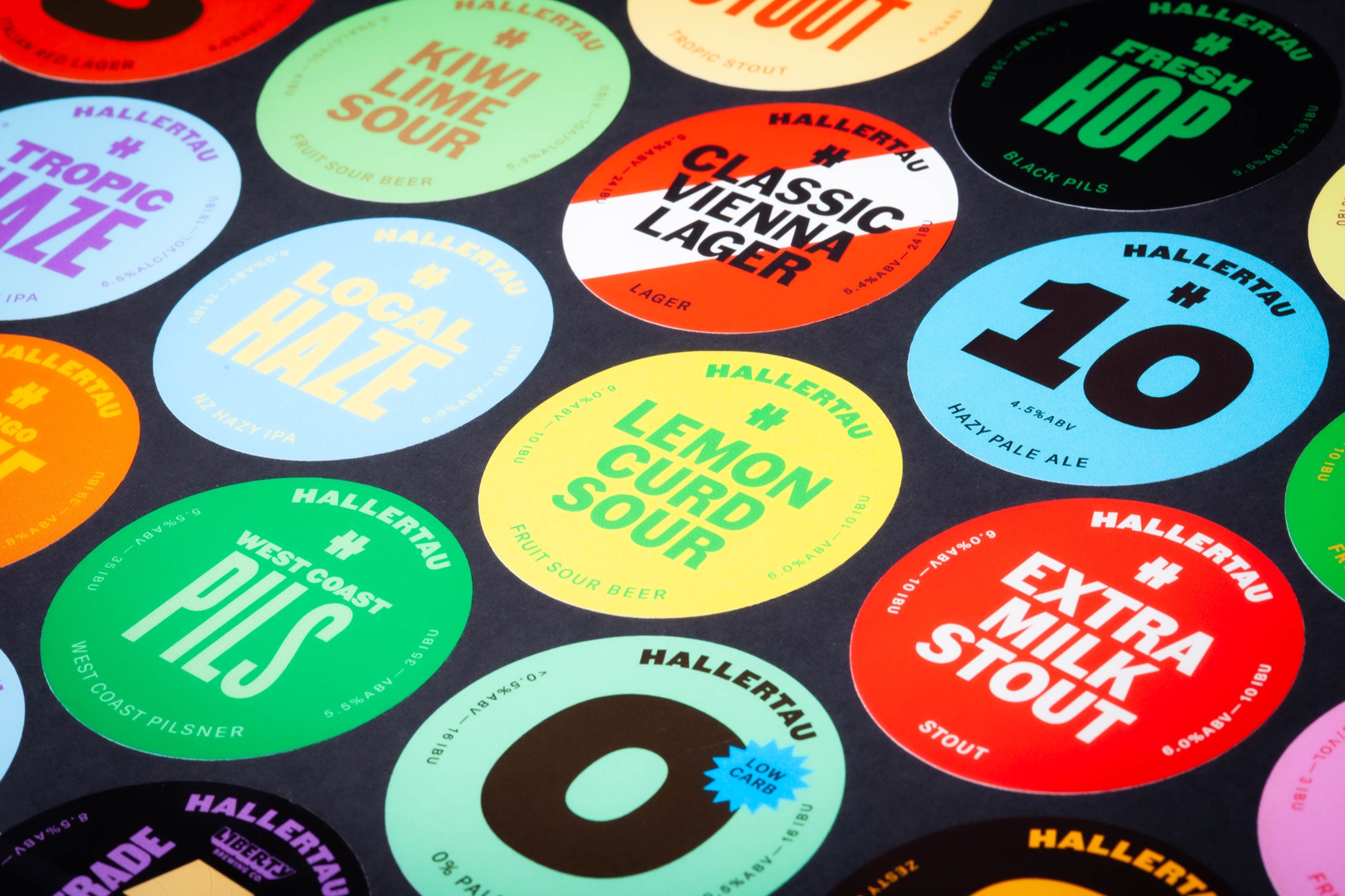 Custom printed tap badges for Hallertau Brewery, removable vinyl with bold colour graphics.