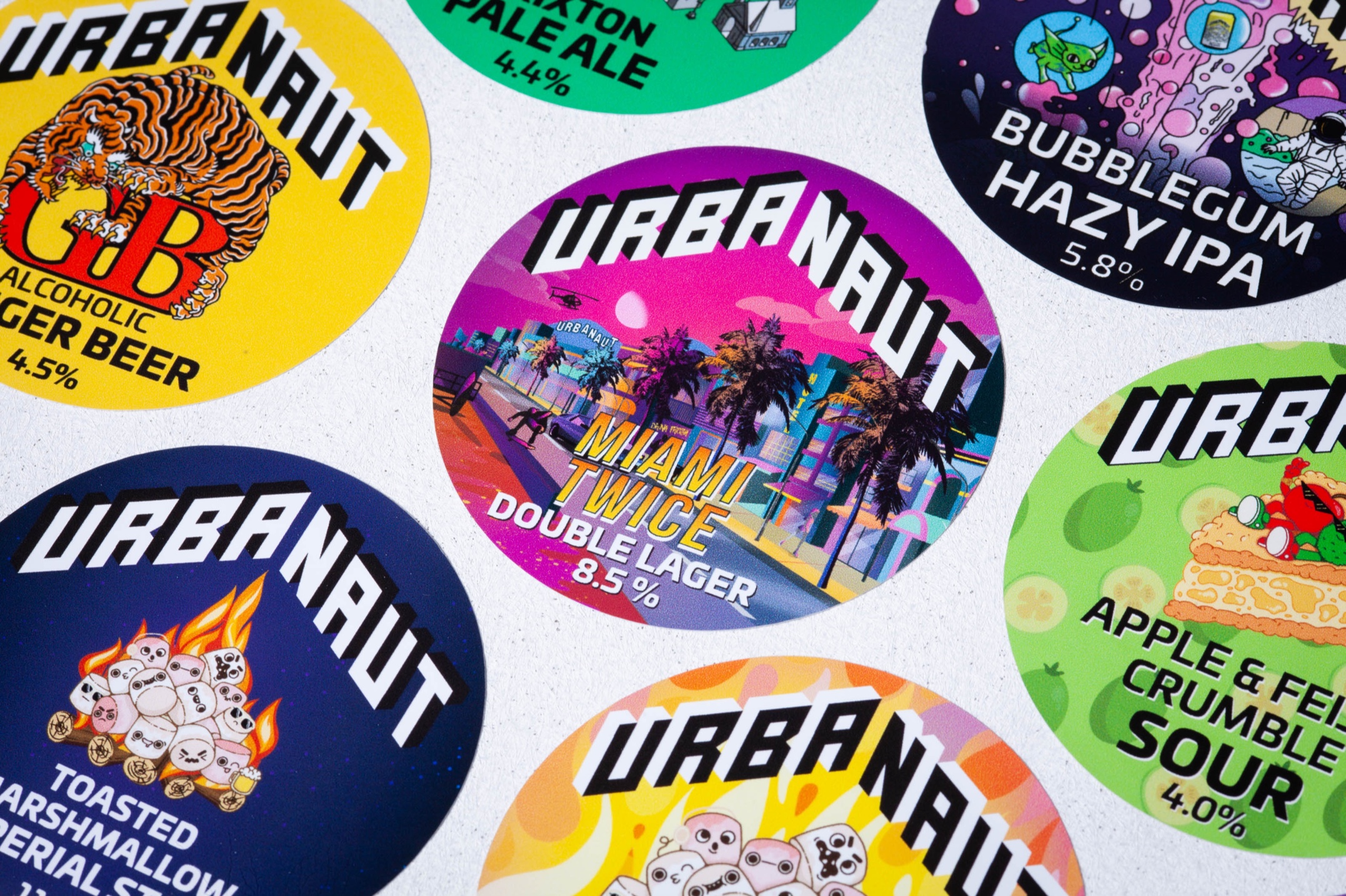 Custom printed tap badges for Urbanaut Brewing Co. using removable vinyl with bold colour graphics.