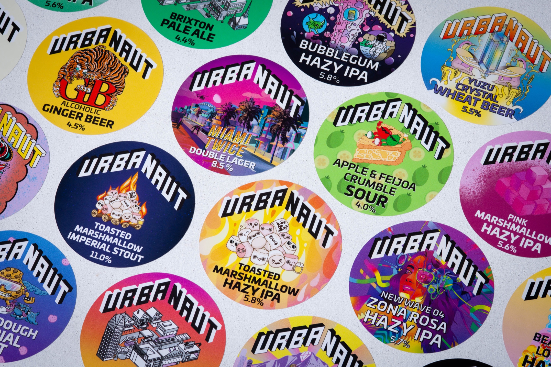 Custom printed tap badges for Urbanaut Brewing Co. using removable vinyl with bold colour graphics.