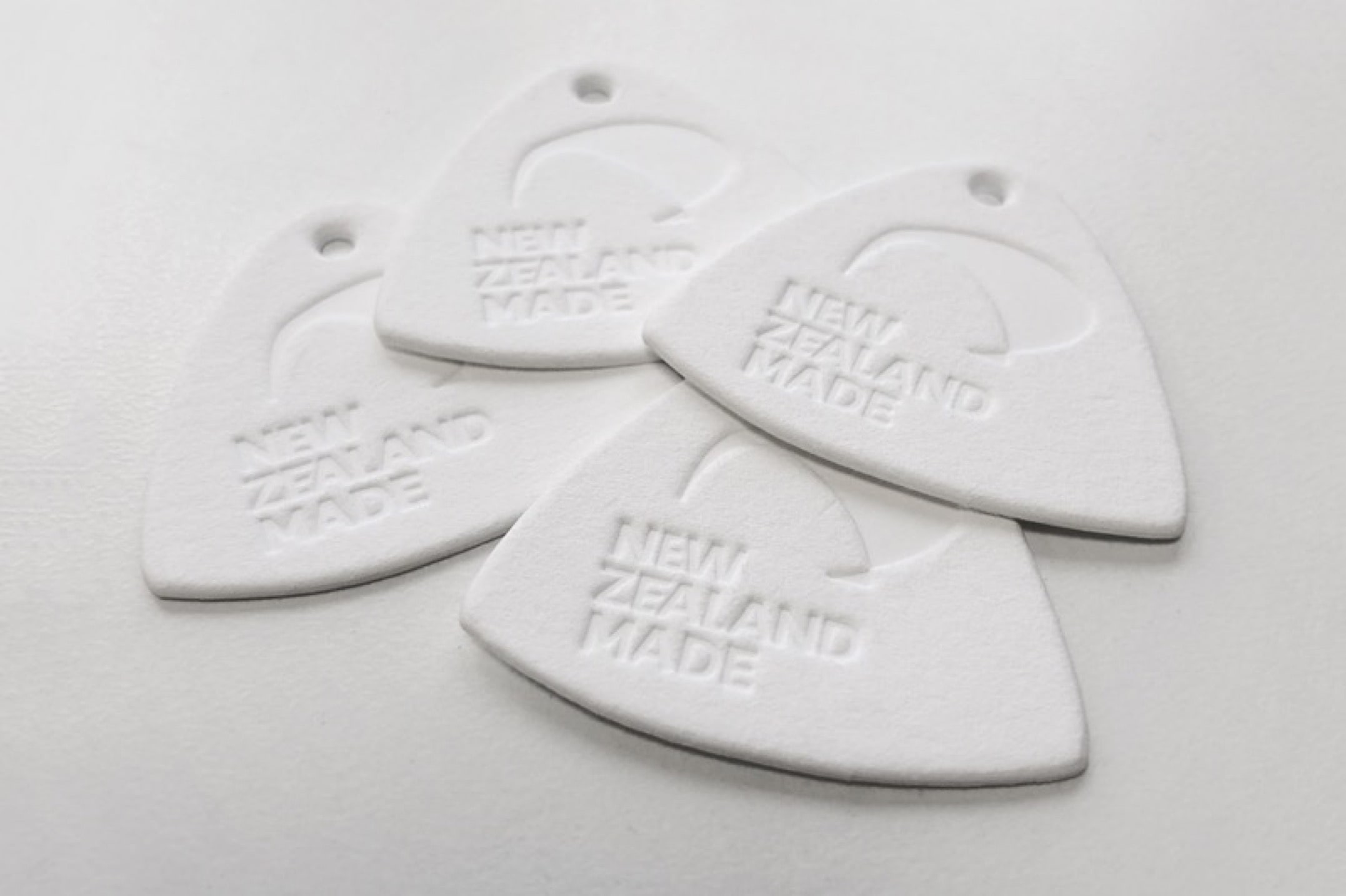 Plastic swing tags - embossed and die cut