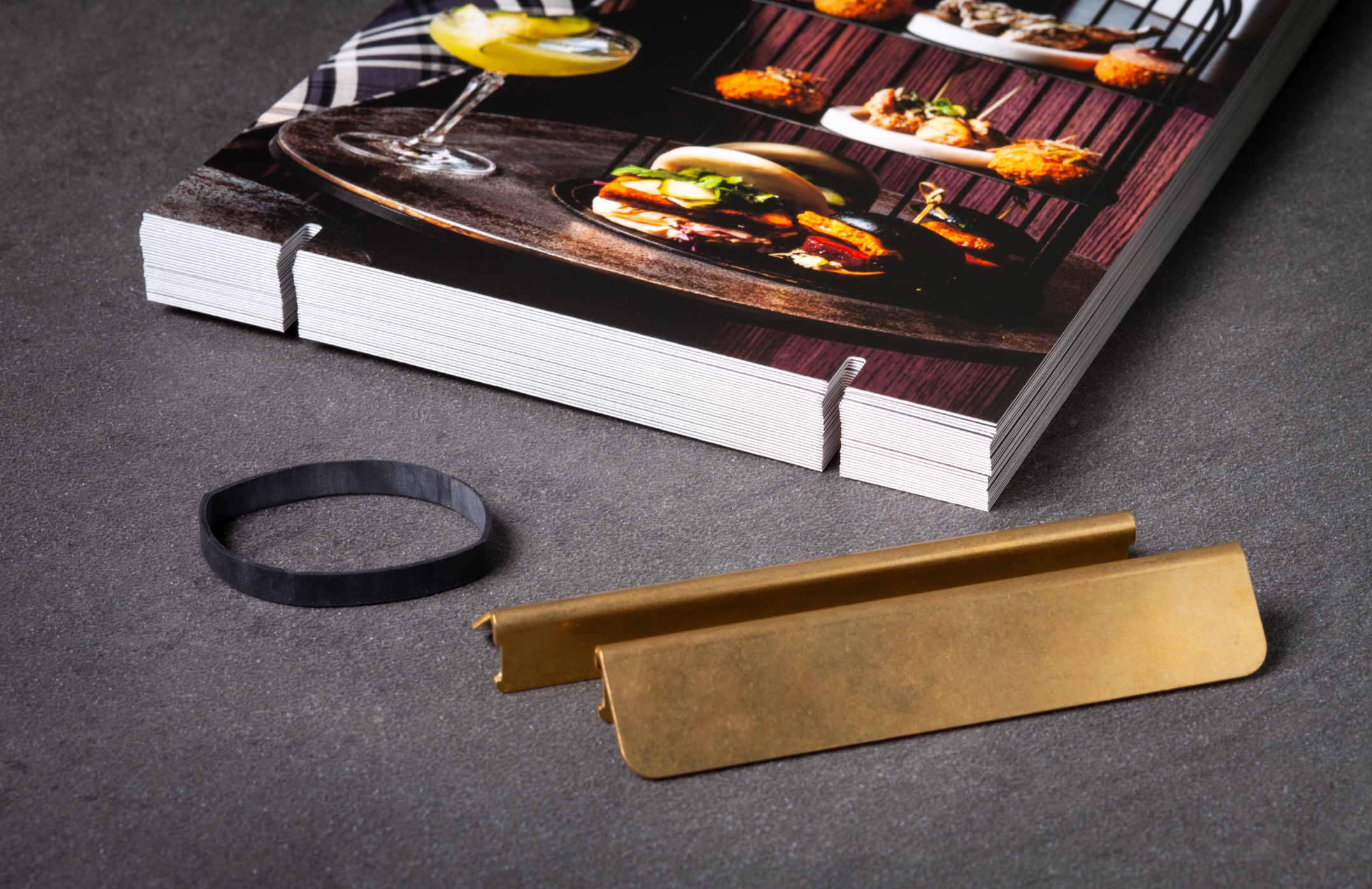 Brass Menu Hardware and Premium Printing: Elevating the Dining Experience at Naumi Hotel