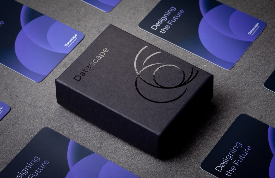 Custom printed corporate cards with matte lamination and diecut round corners, with a spot UV gloss varnished 2-piece carton for Datacom, printed in Wellington by Colourcraft.
